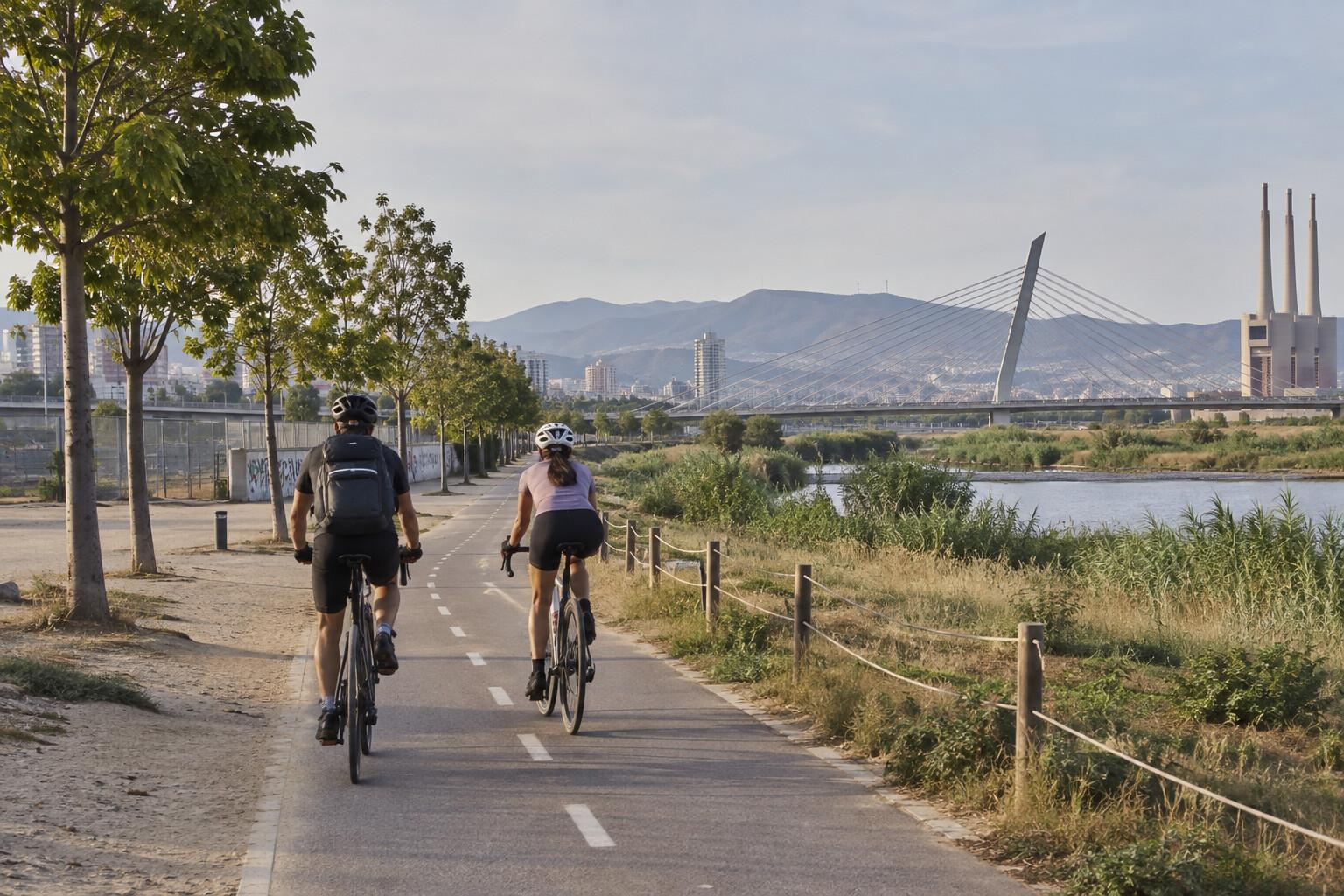 Cyclists entering the Besòs riverside path from Sant Adrià